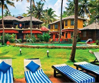 https://imgcld.yatra.com/ytimages/image/upload/t_hotel_yatra_city_desktop/v1435038449/Domestic Hotels/Hotels_Varkala/Krishnatheeram Beach Resort/POOL_SIDE_SITTING_AREA.jpg